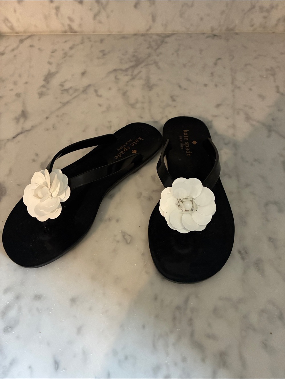 kate spade Black Jelly Toe-Post Sandals with White Floral Appliqués